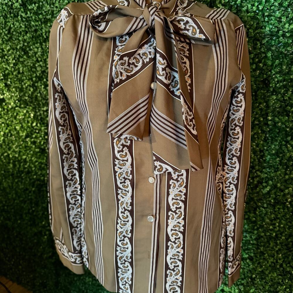 Vintage JH Petites black blouse with a subtle vertical textured stripe pattern.